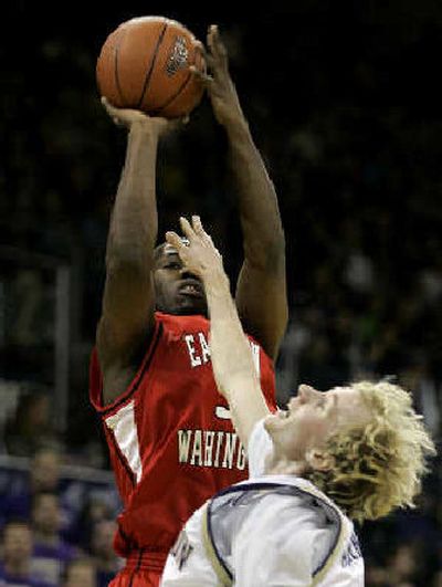 
Eastern Washington's Rodney Stuckey shoots over Washington's Ryan Appleby. Stuckey scored a game-high 31 points, but only 10 in the second half as he got into foul trouble.
 (Associated Press / The Spokesman-Review)