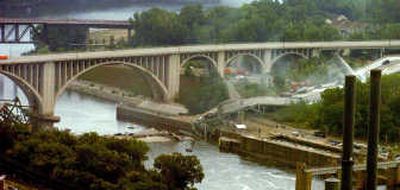 
The bridge deck lies in the Mississippi River after Wednesday's collapse of the Interstate 35W bridge between Minneapolis and St. Paul.St. Paul Pioneer Press
 (Sherri LaRose-Chiglo St. Paul Pioneer Press / The Spokesman-Review)