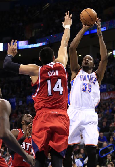 Kevin Durant, shooting over Gustavo Ayon, scored 41 points. (Associated Press)