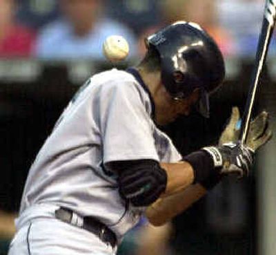
Seattle's Ichiro Suzuki is hit by a pitch from Kansas City' starting pitcher Jimmy Serrano during Wednesday's game. 
 (Associated Press / The Spokesman-Review)
