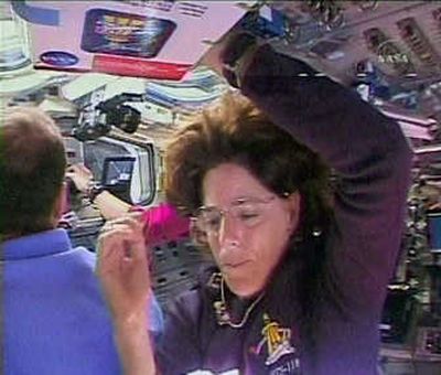 
In this image from NASA TV, mission specialist Barbara Morgan works in the aft flight deck on the shuttle Endeavour on Thursday. Morgan  formerly taught elementary school  in McCall, Idaho.  Associated Press
 (Associated Press / The Spokesman-Review)