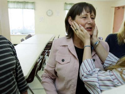 
Jennifer Thim, receives congratulations from a friend Thursday as she takes part in a brief graduation ceremony at the Prosperity Recovery House in Sumner, Wash., after successfully completing a 28-day treatment program for alcohol addiction.  
 (Associated Press / The Spokesman-Review)