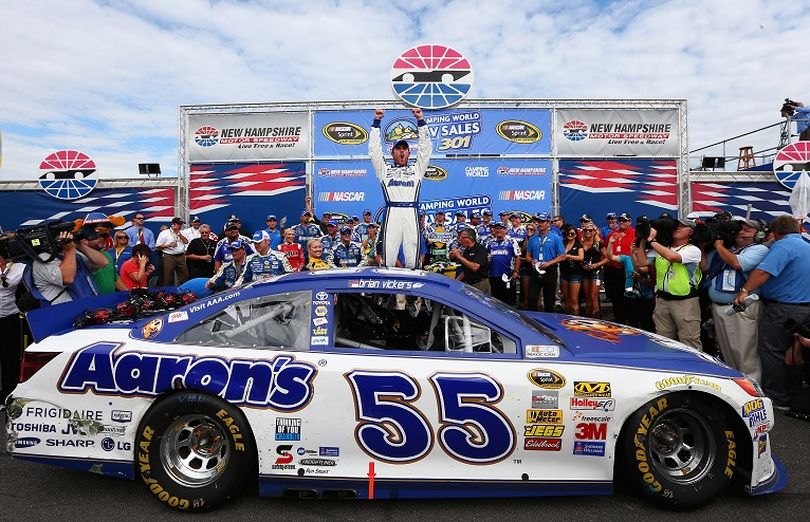 Brian Vickers, driver of the #55 Aaron's Dream Machine Toyota, celebrates in Victory Lane after winning the NASCAR Sprint Cup Series Camping World RV Sales 301 at New Hampshire Motor Speedway on July 14, 2013 in Loudon, New Hampshire. (Photo Credit: Jerry Markland/Getty Images) (Jerry Markland / Getty Images North America)