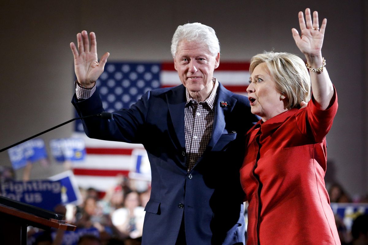 Democratic presidential candidate Hillary Clinton, right, waves on stage with her husband and former President Bill Clinton for a Nevada Democratic caucus rally, Saturday, Feb. 20, 2016, in Las Vegas. (John Locher / Associated Press)