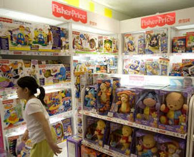 
A child walks away from a store  selling Fisher-Price toys in Beijing, China, on Thursday. Associated Press
 (Associated Press / The Spokesman-Review)