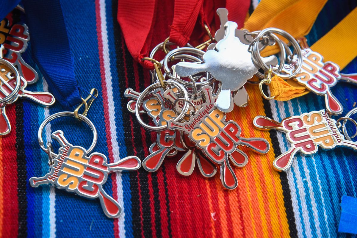 Winner’s medals await the Spokatopia SUP Cup recreation and elite division participants racing paddleboards Sunday at Boulder Beach. (Dan Pelle / The Spokesman-Review)