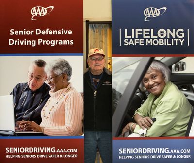 Driver's education training instructor Bill Biasella, Jr., of the AAA in Akron, Ohio, shows some of the posters that promote their senior driving programs on March 6.