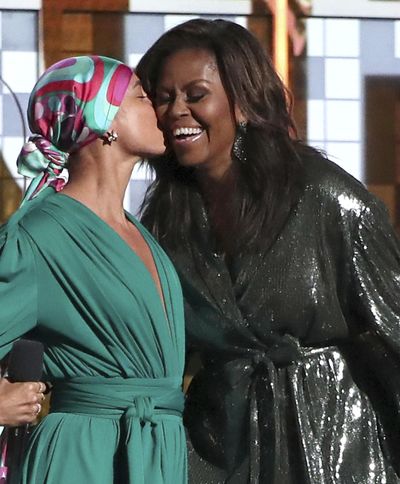 Alicia Keys, left, kisses Michelle Obama at the 61st annual Grammy Awards on Sunday in Los Angeles. (Matt Sayles / Matt Sayles/Invision/AP)