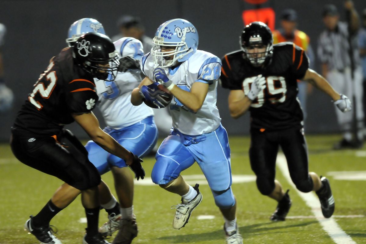 Central Valley running back Taylor Evans picks his way through the LC defense en route to a long gain in the first half at Albi Stadium on Friday. (Jesse Tinsley / The Spokesman-Review)
