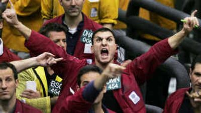 
A trader shouts orders Tuesday at the Chicago Mercantile Exchange as the Fed pushed its key interest rate up by a quarter-point to 2.75 percent.
 (Associated Press / The Spokesman-Review)