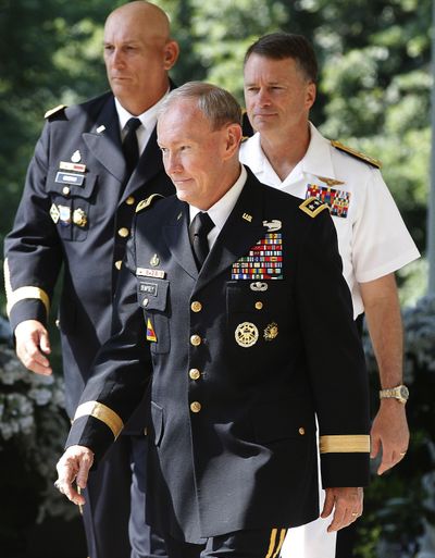 Nominees Army Gen. Martin Dempsey, center, Adm. James Winnefeld, right, and Gen. Ray Odierno attend Monday’s announcement. (Associated Press)