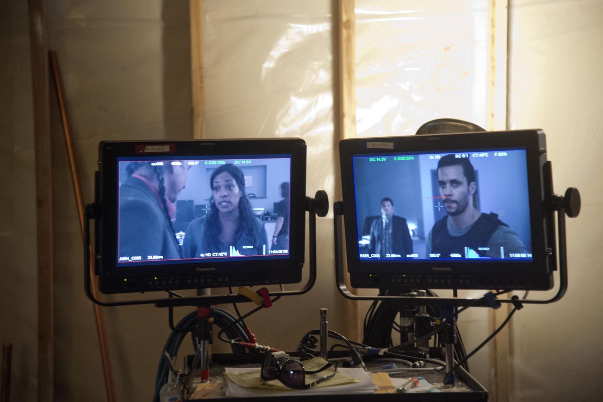 Video monitors show the action to crew members away from the set during filming of the TV series ""Z Nation", Thursday, Aug. 6, 2015, at Northern Quest Casino. In the episode being filmed, the zombie survivors stumble across an Indian casino that survives despite the apocalypse. At left is actress Kellita Smith and at right is Matt Cedeño. (Jesse Tinsley / The Spokesman-Review)