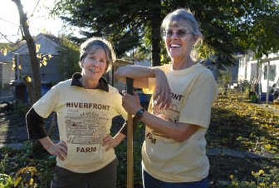 
Kathy Dellwo and Mary Naber work Tuesday at Riverfront Farm, 2605 W. Boone Ave., where the goal is to have neighbors and at-risk youth work together. 
 (Dan Pelle / The Spokesman-Review)