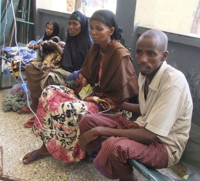 Malnourished children from southern Somalia get treatment in a corridor of the Banadir hospital in Mogadishu on Friday. (Associated Press)