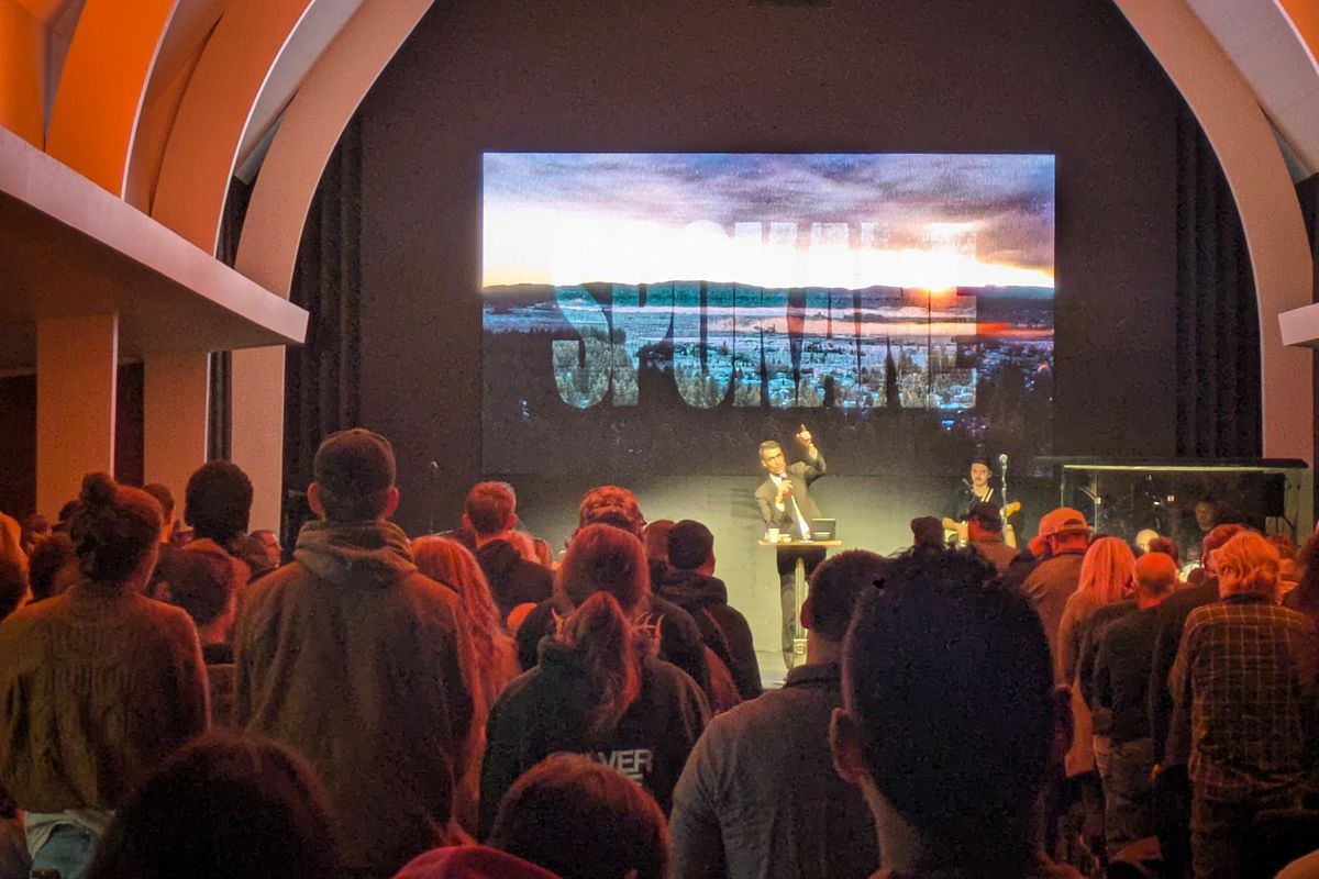 Pastor Russell Johnson stands at the pulpit of the Pursuit NW church on March 15 in Browne’s Addition. The Pursuit has moved into the former All Saints Lutheran Church.  (Emry Dinman/THE SPOKESMAN-REVIEW)