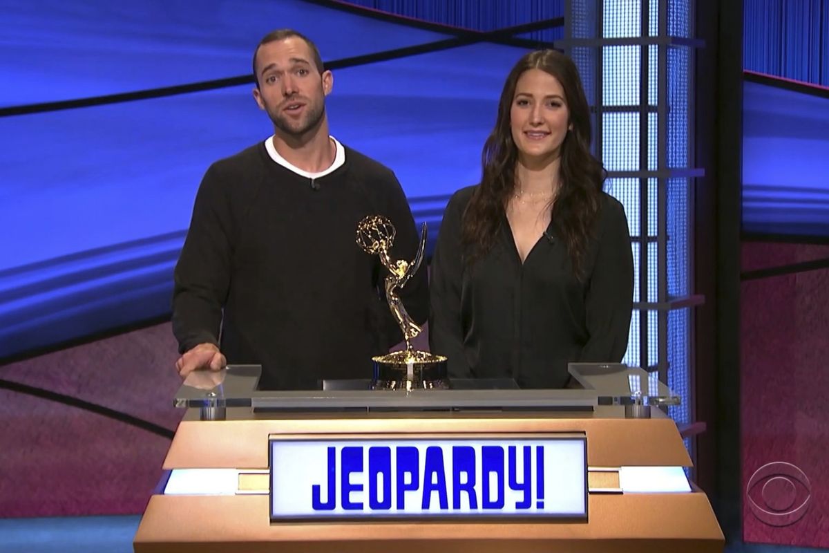 In this video image provided by NATAS and the Daytime Emmys, Matt Trebek, left, and Emily Trebek, children of the late Alex Trebek, accept the award for outstanding game show host for "Jeopardy!" on his behalf during the 48th Daytime Emmy Awards on Friday, June 25, 2021.  (HONS)