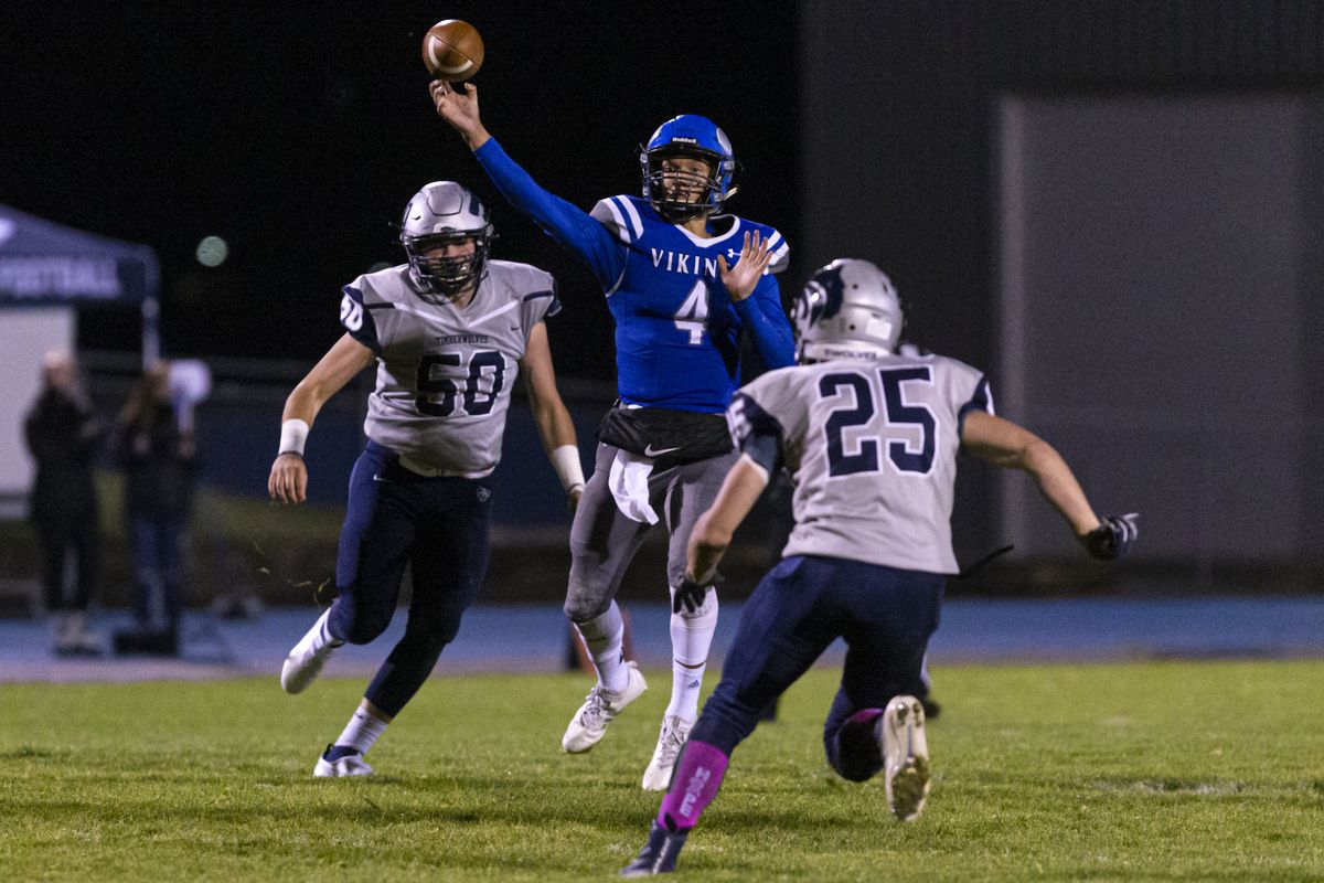 Coeur d’Alene quarterback Jack Prka threw five touchdown passes and ran for two scores Friday during a 64-34 win over rival Lake City.  (Cheryl Nichols/For The Spokesman-Review)