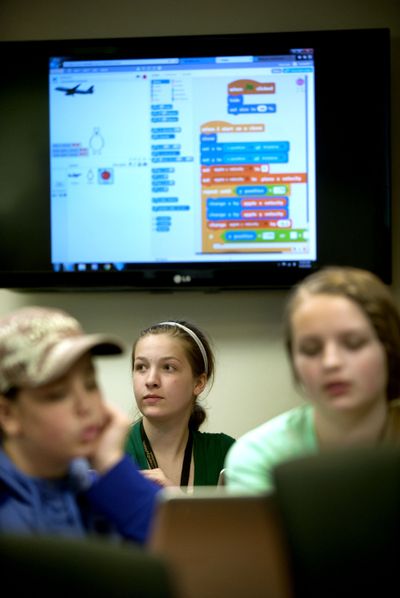 Rylie Rasmussen, 13, center, of Hayden, participates Thursday in University of Idaho’s software coding camp for middle school girls at the Coeur d’Alene campus. (Kathy Plonka)