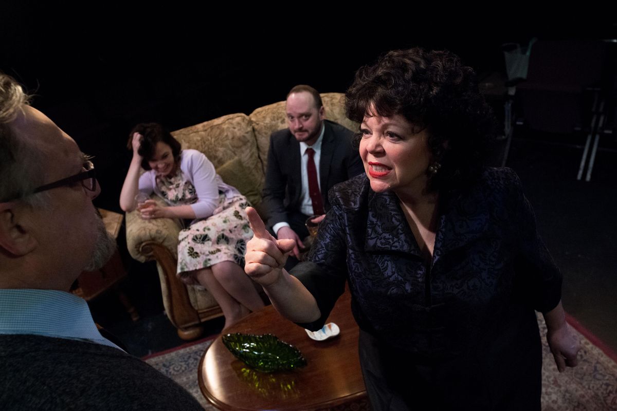 Mary Starkey, right, playing Martha, and Jamie Flanery, left, playing George; act out a scene with Emily Jones, background left, playing Honey, and Danny Anderson, background right, playing Nick during a rehearsal of “Who’s Afraid of Virginia Woolf?” (Tyler Tjomsland / The Spokesman-Review)