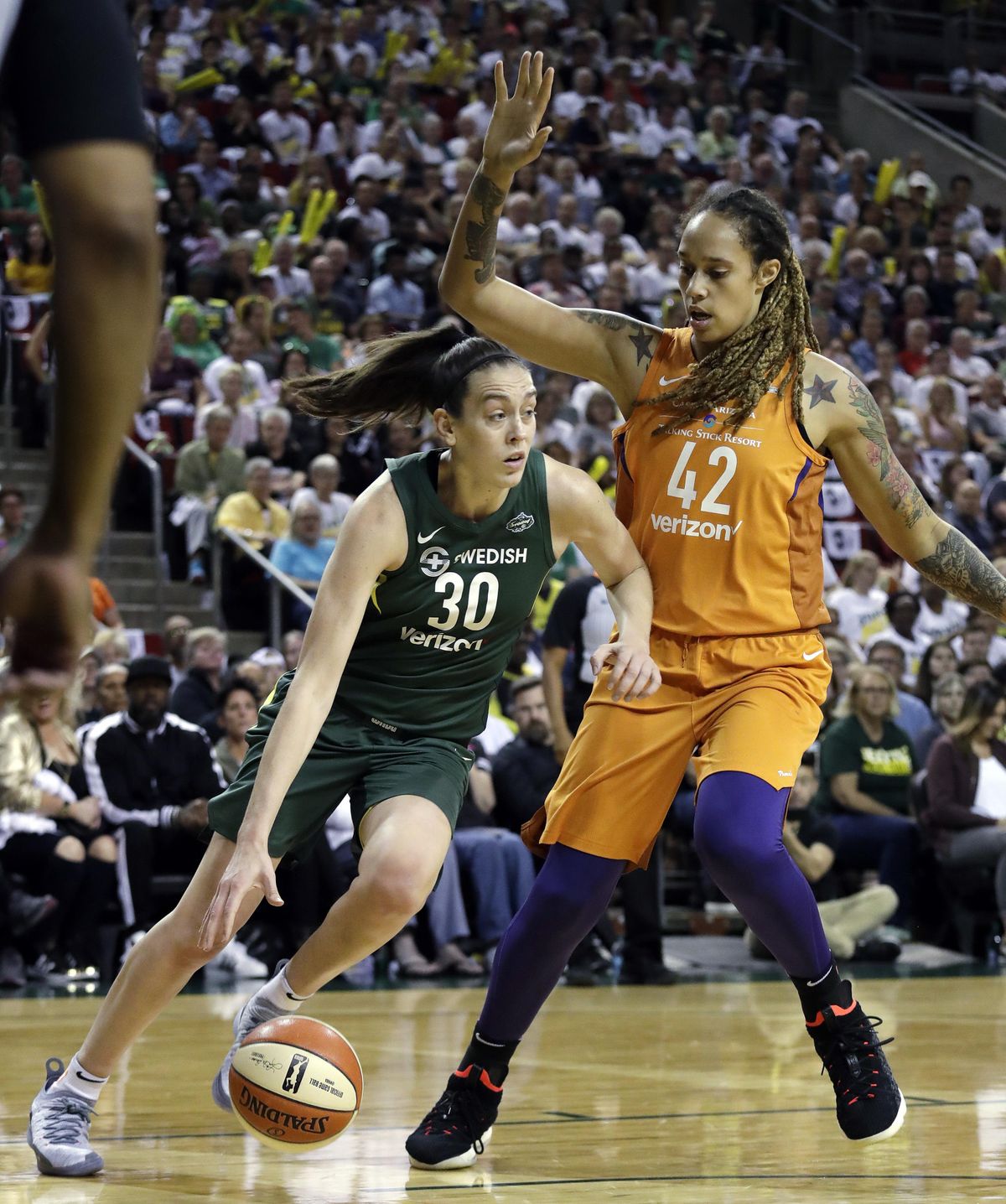 Seattle’s Breanna Stewart tries to drive past Phoenix’s Brittney Griner in the first half Tuesday in Seattle. (Elaine Thompson / AP)