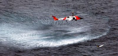 Jayhawk helicopter crew prepares the rescue of a French kayaker from the Bering Sea on Saturday.  (Associated Press / The Spokesman-Review)