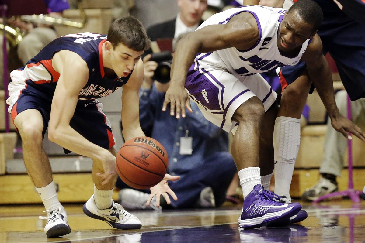 David Stockton, left, steals ball from Derrick Rodgers (Associated Press)