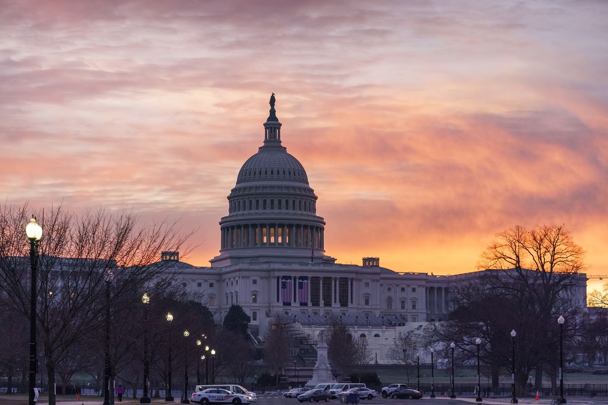 Dawn breaks at the Capitol in Washington, Monday, Jan. 11, 2021. House Speaker Nancy Pelosi, D-Calif., is calling for congressional action to rein in President Donald Trump after inciting last week