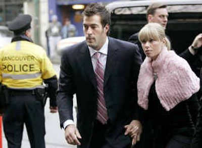 
NHL star Todd Bertuzzi, accompanied by his wife Julie, arrives at Provinical Court in Vancouver, British Columbia, on Wednesday. 
 (Associated Press / The Spokesman-Review)