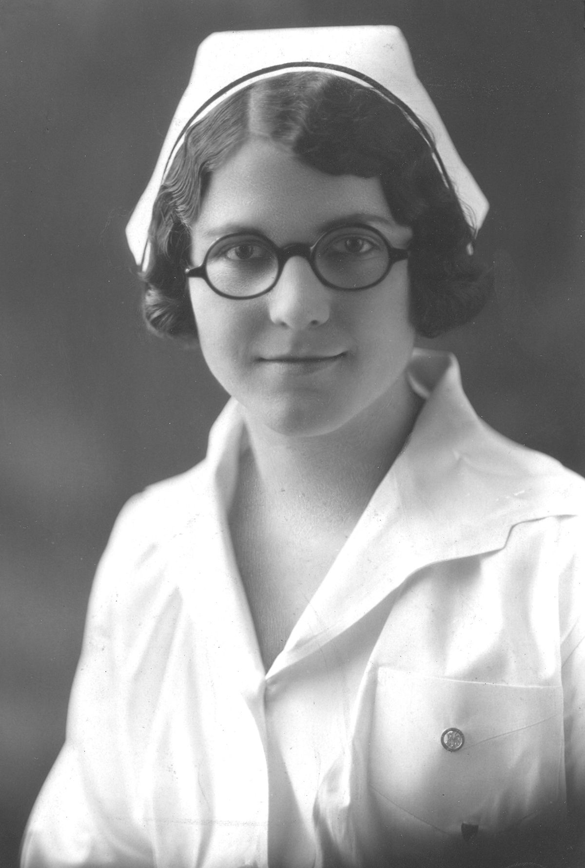 At left, a Spokane nursing student wears a pin on her uniform, but it’s too tiny to tell whether she earned her degree at Sacred Heart or Deaconess nursing school. Her hair is styled in a “finger wave” popular in the 1920s and 1930s. Both hospitals had schools in those decades.