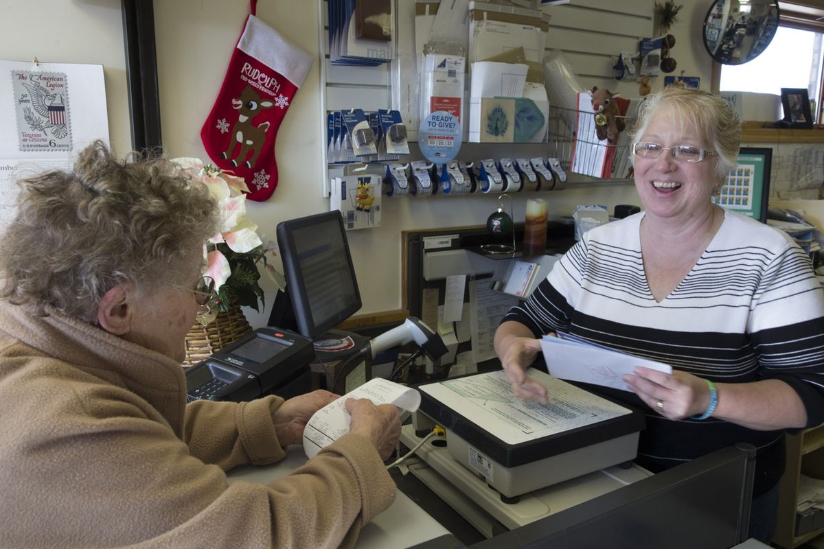 Rachael Sackmann, left, talks with postmaster Becky Trzebiatowski while mailing Christmas cards on Dec. 1 at the post office in Rudolph, Wis. Trzebiatowski said they get tens of thousands of pieces of mail from all over the world every year.