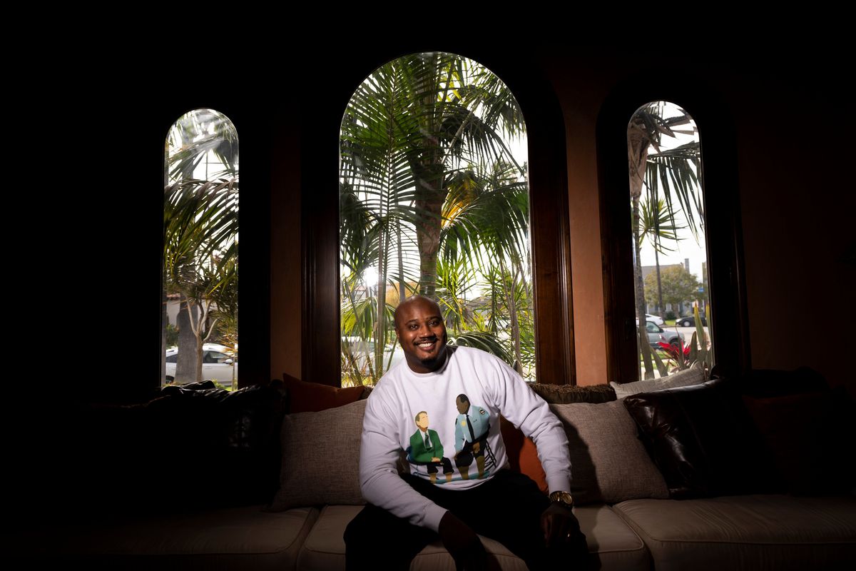 Brandon Brown poses for photos Thursday in Los Angeles. Brown, a former history teacher and assistant high school principal, is now a Billboard-charting educational rapper who performs around the U.S.  (Jae C. Hong)