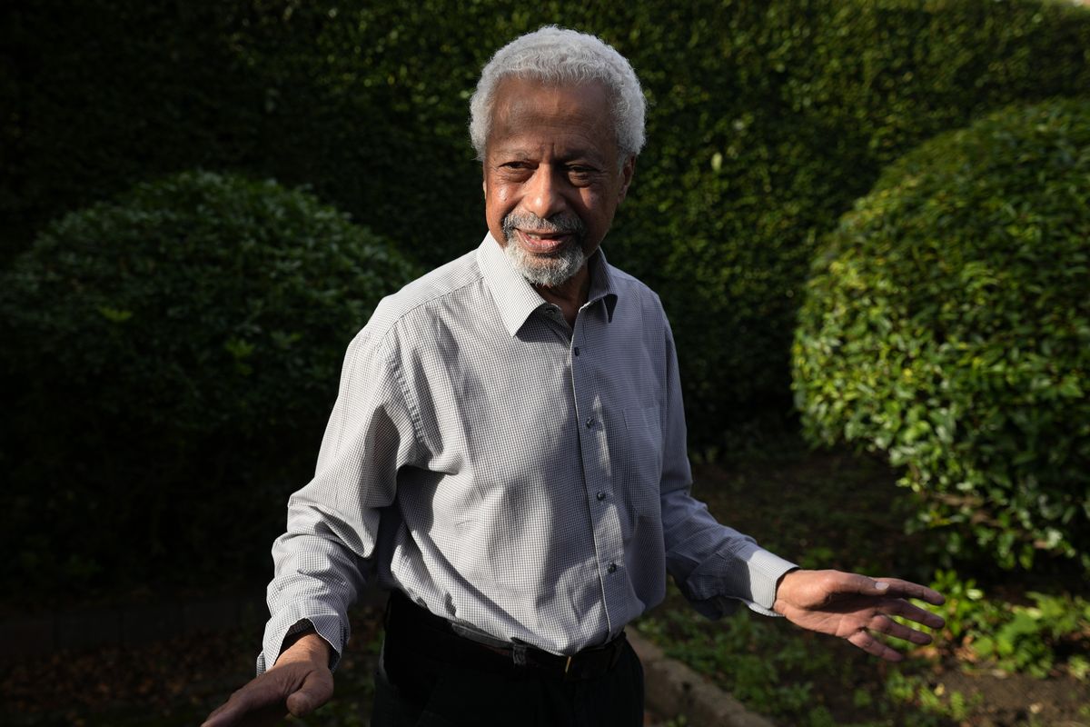Tanzanian writer Abdulrazak Gurnah gestures as he poses for a photo at his home in Canterbury, England, Thursday, Oct. 7, 2021. Gurnah was awarded the Nobel Prize for Literature earlier on Thursday. The Swedish Academy said the award was in recognition of his "uncompromising and compassionate penetration of the effects of colonialism."  (Frank Augstein)