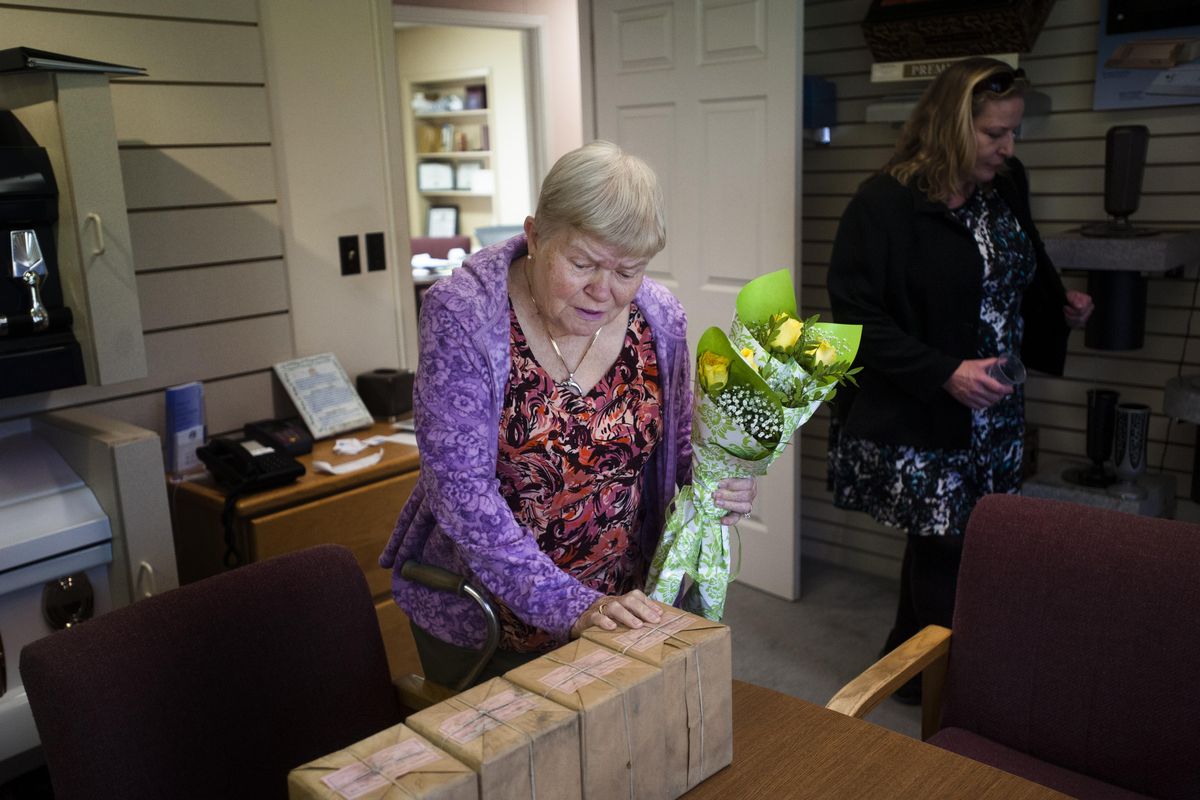 Marjorie Dunston reacts as she sees for the first time the remains of her four siblings who perished in a 1951 house fire on Wednesday, Sept. 21, 2016, at Fairmount Memorial Park in Spokane, Wash. (Tyler Tjomsland / The Spokesman-Review)