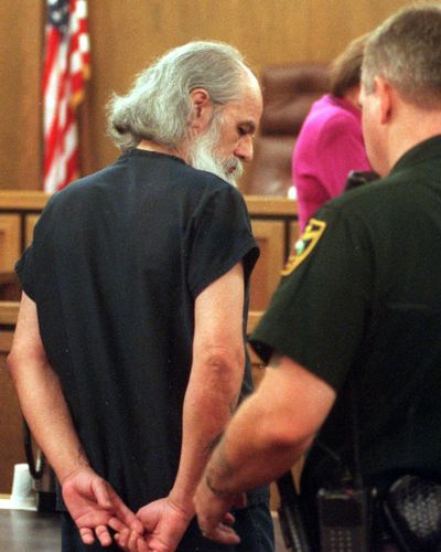 Greg McCrea is handcuffed as officers prepare to escort him from a Spokane County courtroom in 1999. The serial child rapist and bomb builder was booked into the Spokane County Jail on Monday, Oct. 21, 2019, days after his release from federal prison. (Shawn Jacobson / The Spokesman-Review)