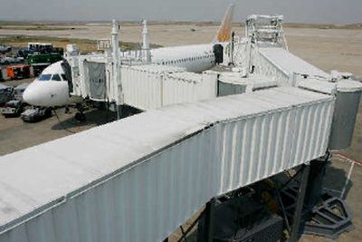 
United uses its new fully automated duel end over the wing loading bridge at Denver International Airport on Thursday. 
 (Associated Press / The Spokesman-Review)