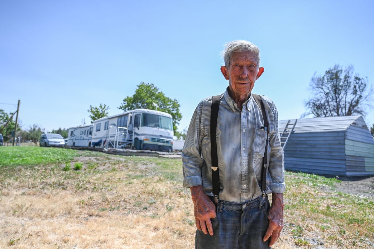 Jim Jacobs, 90, stands on his home site in July and talks about life in Malden. He lives in a motor home on the site of the home he lost in the 2020 Labor Day fire that destroyed the town. Jacobs lost his wife just days after the fire. He hopes to have some kind of permanent home on the site before winter.  (Jesse Tinsley/THE SPOKESMAN-REVI)