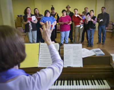 
Donna Douglass signals the start of a song as she works with On Stage! performers during rehearsal Thursday for their  Christmas show. 
 (Photos by Christopher Anderson / The Spokesman-Review)