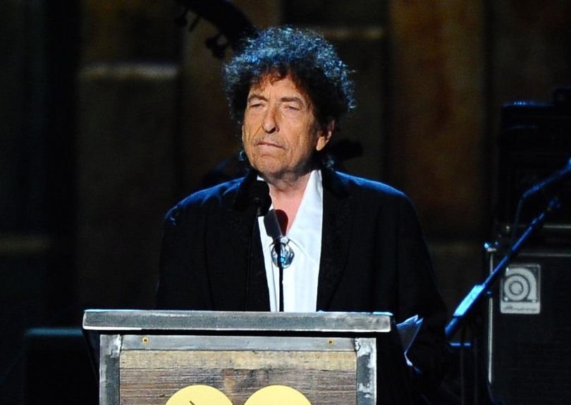 FILE - In this Feb. 6, 2015 file photo, Bob Dylan accepts the 2015 MusiCares Person of the Year award at the 2015 MusiCares Person of the Year show in Los Angeles.  Phrases sprinkled throughout the rock legend's lecture for his Nobel Prize in literature are very similar to phrases from the summation of 