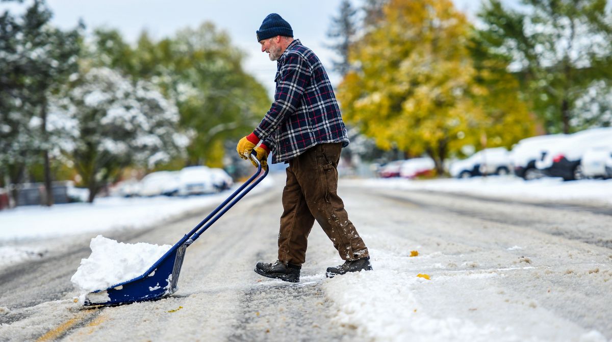 “These shovels are the best,” said Roy Steele as he shovels snow near his Post Falls home on Monday.  (Kathy Plonka/The Spokesman-Review)