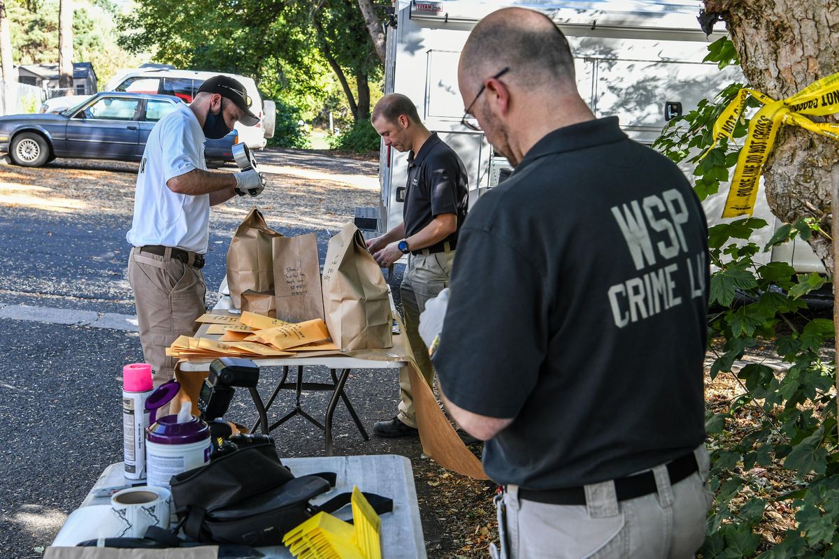 WSP Crime Lab members bag evidence at the scene of a shooting near the WSU campus in 2021.  (Dan Pelle/THE SPOKESMAN-REVIEW)