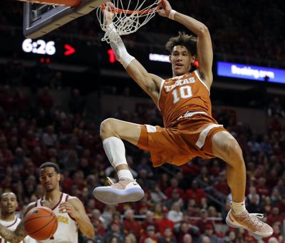 In this Feb. 2, 2019 photo, Texas forward Jaxson Hayes (10) dunks the ball over Iowa State guard Nick Weiler-Babb, left, during the first half of an NCAA college basketball game, in Ames, Iowa. Hayes needed only a year at Texas to put himself at the front of the class of big men in the NBA draft coming Thursday, June 20, 2019. (Charlie Neibergall / Associated Press)