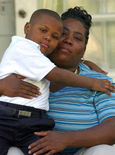 Mekel Finch holds her 5-year-old son, Izell Finch, at their home, Wednesday in Cincinnati.
(Associated Press / The Spokesman-Review)