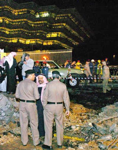 
Saudi police officers look at the debris caused by an explosion near Saudi Arabia's interior ministry after an explosion in Riyadh late Wednesday.
 (Associated Press / The Spokesman-Review)