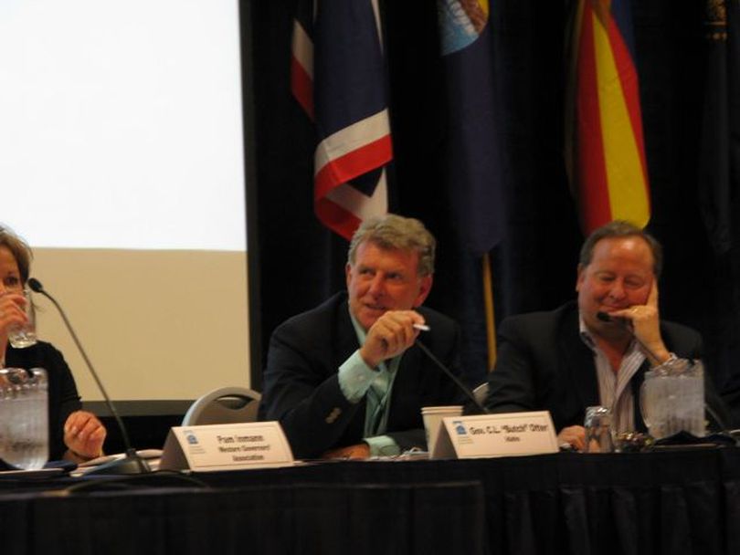 During a WGA session on industrial energy efficiency, Idaho Gov. Butch Otter jokes that energy efficiency savings at his former longtime employer, Simplot Corp., should boost his retirement check; at right is Montana Gov. Brian Schweitzer. (Betsy Russell)