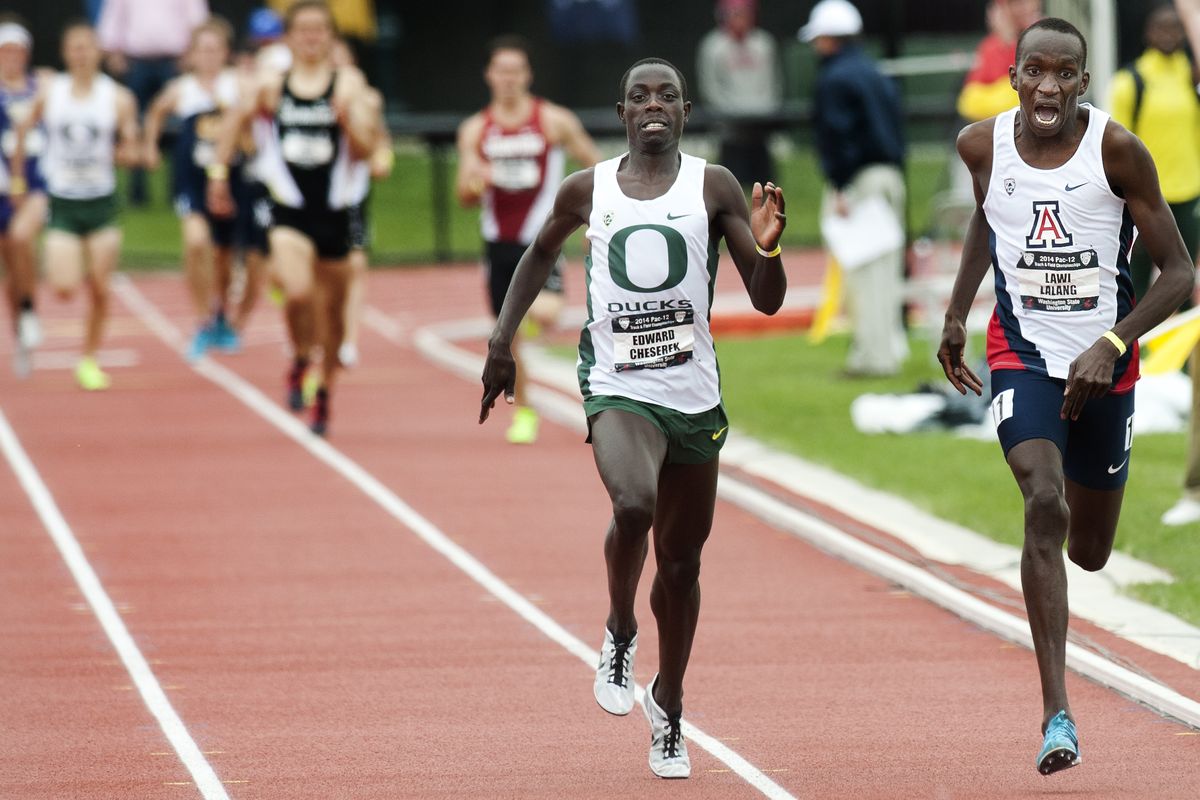 Arizona’s Lawi Lalang, right, edges Oregon’s Edward Cheserek in the thrilling finish to the men’s 1,500-meter race on Sunday. (Tyler Tjomsland)