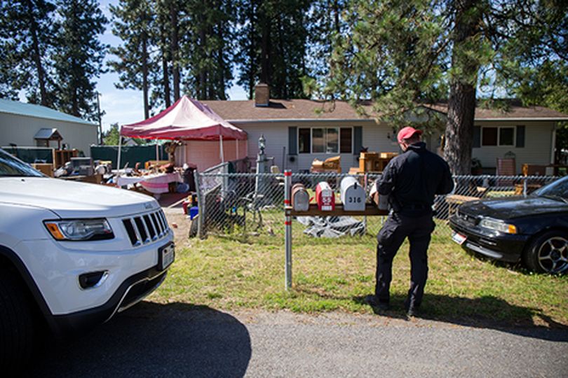 John Cantrell, from the North Idaho Violent Crime Task Force��continues an investigation at 319 W. 20th Avenue in Post Falls. The Post Falls Rathdrum Multi Agency SWAT Team performed a planned search warrant that resulted in 11 people arrested and two people who were issued citations and released. (Tess Freeman/press)