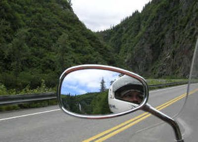 
Carey J. Williams is shown in the mirror of his motorcycle as he drives down the highway to Valdez, Alaska.
 (The Spokesman-Review)