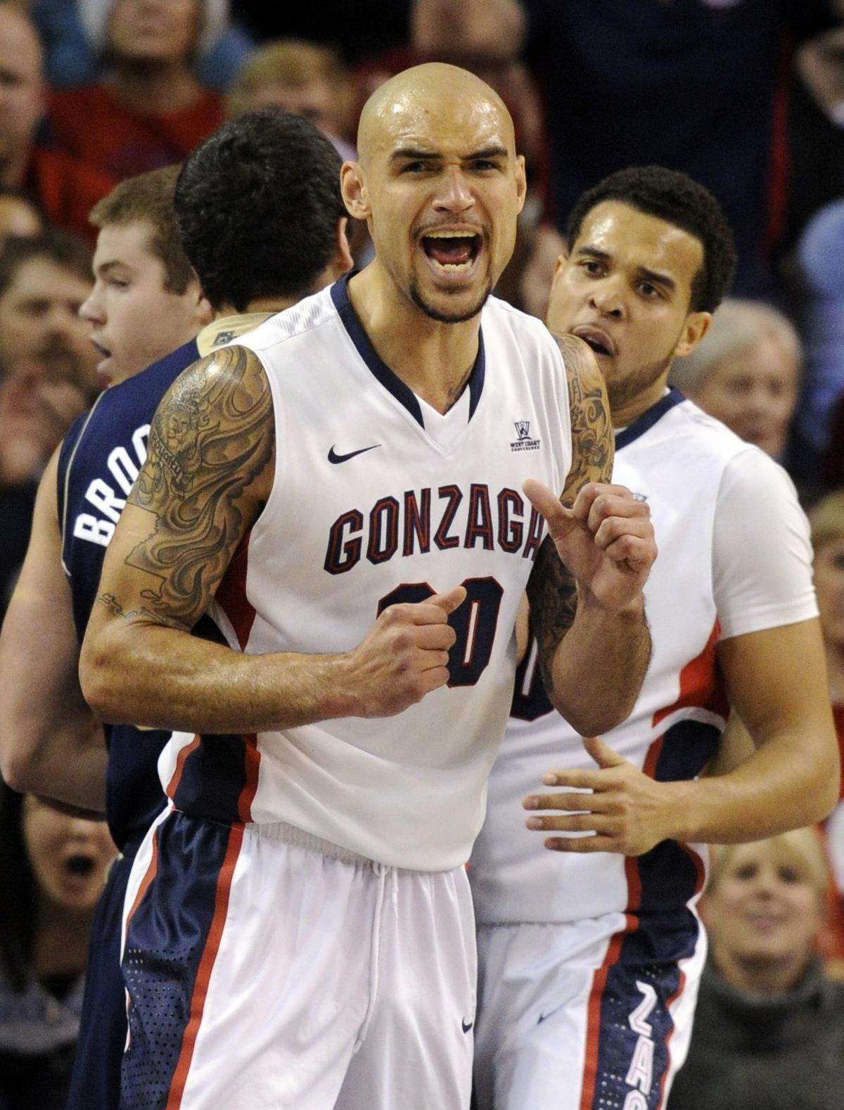 Gonzaga’s Robert Sacre celebrates a basket during the first half against Notre Dame. (Colin Mulvany)
