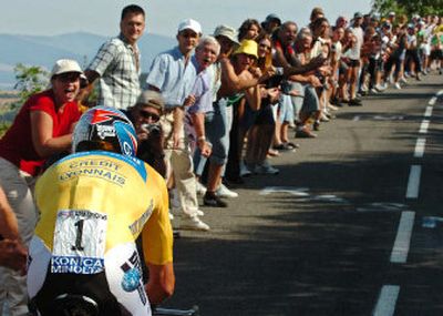 
Tour de France fans cheer Lance Armstrong en route to a victory in the 20th stage, leaving him one stage away from his seventh straight title.
 (Associated Press / The Spokesman-Review)