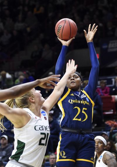 Quinnipiac’s Aryn McClure (25) shoots over Miami’s Leah Purvis (21) during a first-round game in the women’s NCAA Tournament in Storrs, Conn., Saturday, March 17, 2018. (Stephen Dunn / Associated Press)